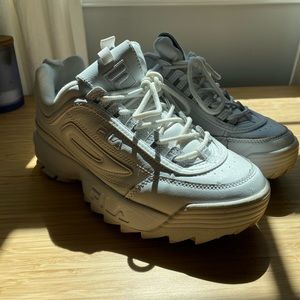 All white Fila sneakers